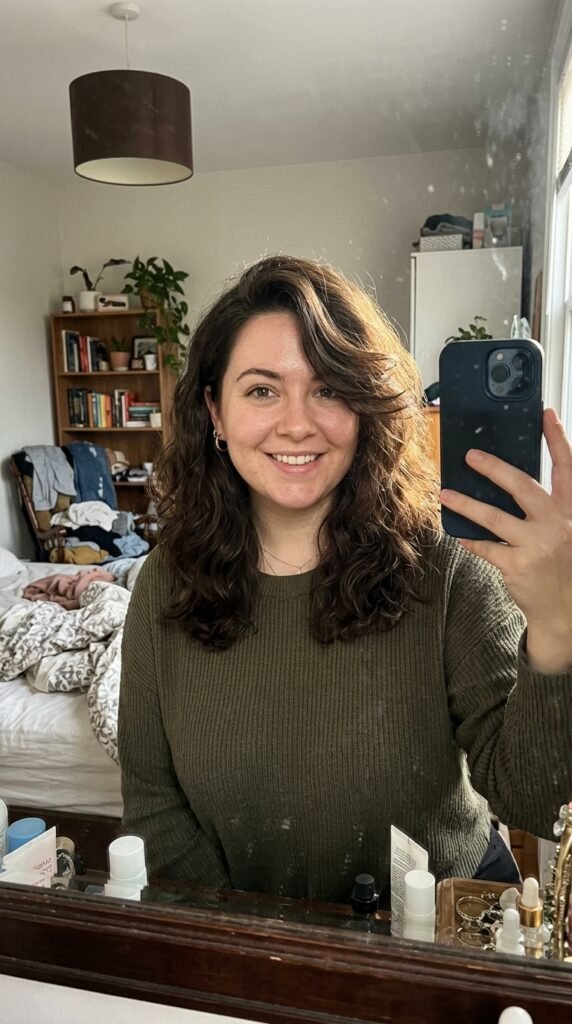 Woman taking mirror selfie 202605131535