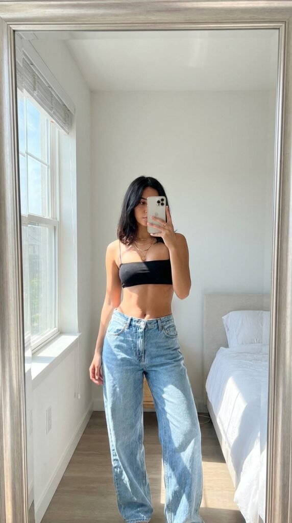 15 Jeans Summer Outfit Ideas That Are Stylish and Easy to Recreate 8 Woman wearing jeans bandeau top 202605311442