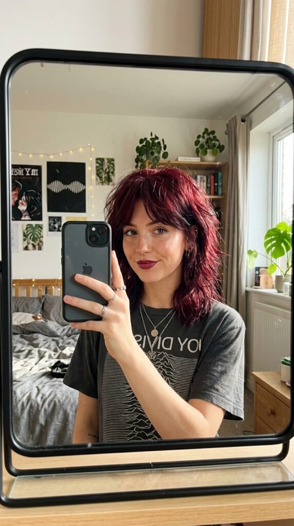 Woman taking mirror selfie 202606191730