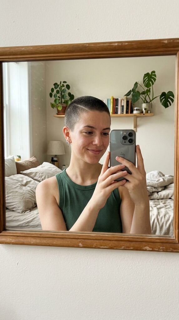 12 Buzz Cut Hairstyles Women Are Loving Right Now 12 Woman taking selfie buzz cut 202606202300