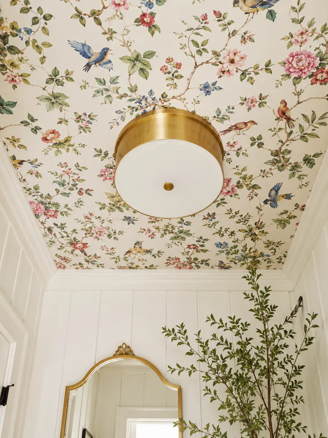 12 Gorgeous Powder Room Ideas for a Stunning Space 13 Vibrant floral wallpaper applied to the ceiling of a white powder room