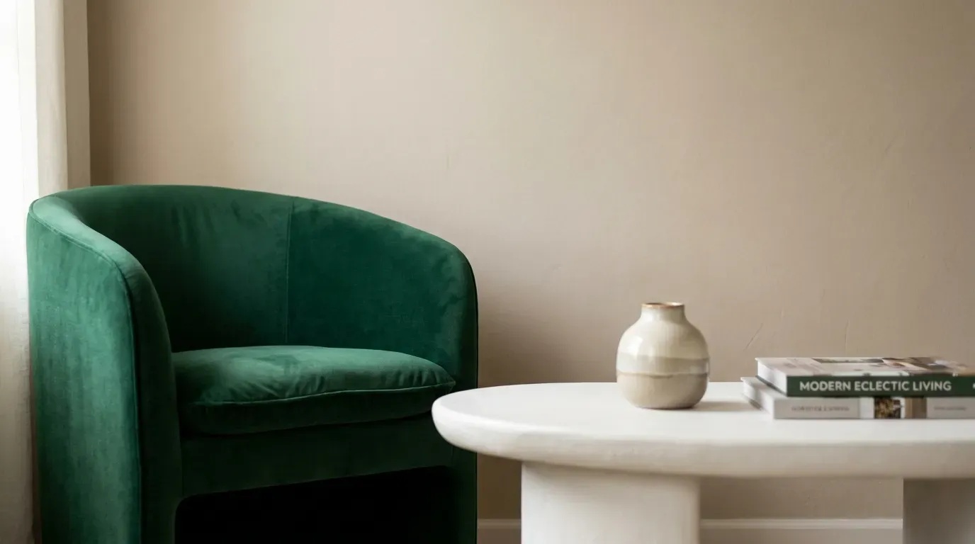 curved velvet chair and sculptural coffee table styled in a living room